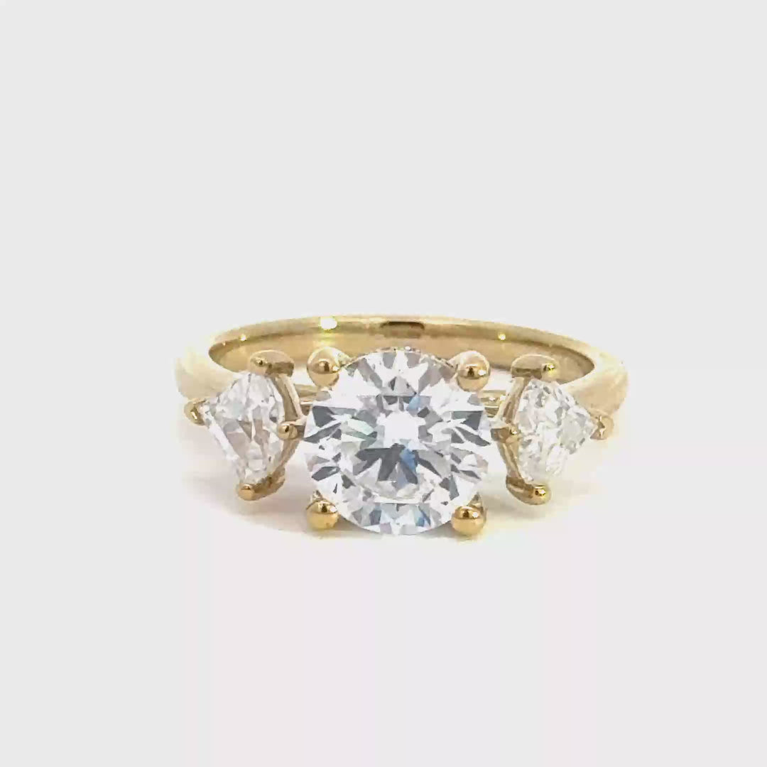 2.6 ctw round diamond three-stone trillion engagement ring