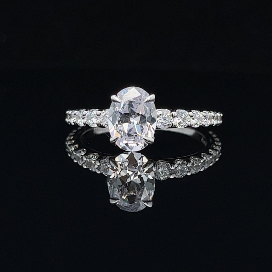 1 1/2 ctw oval diamond engagement ring with graduated diamond accents - valentshop.com