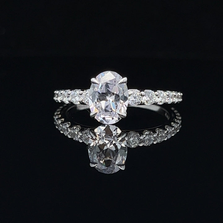 1 1/2 ctw oval diamond engagement ring with graduated diamond accents - valentshop.com