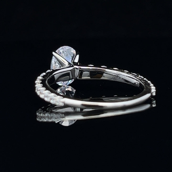 1 1/2 ctw oval diamond engagement ring with graduated diamond accents - valentshop.com