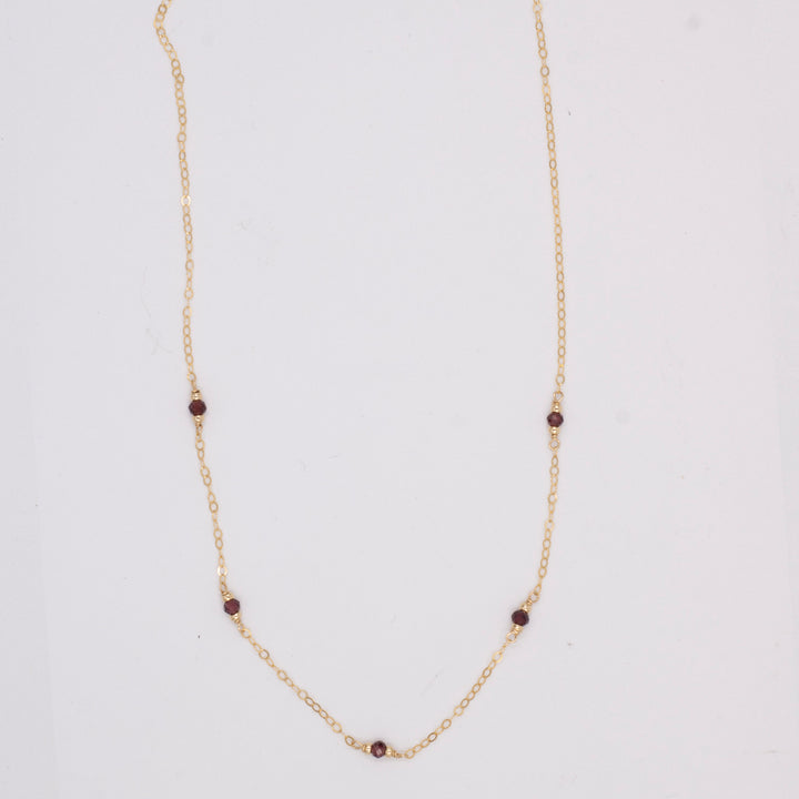 golden rondelle necklace - garnet coin charm - valentshop.com