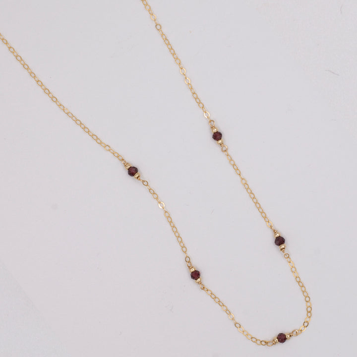 golden rondelle necklace - garnet coin charm - valentshop.com