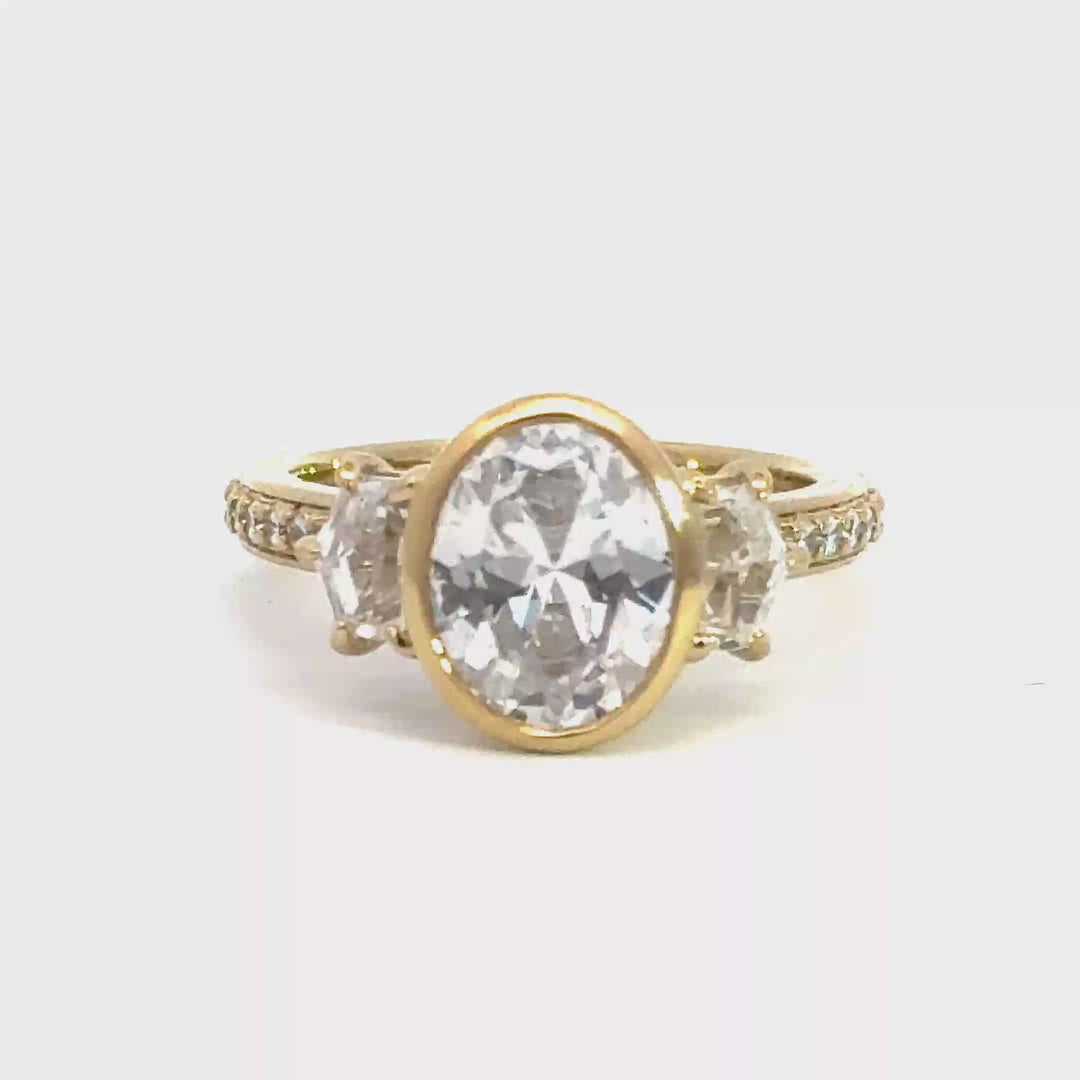 4.1 ctw oval diamond three-stone bezel pentagon with pave band engagement ring